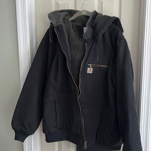 Woman’s black carhartt jacket